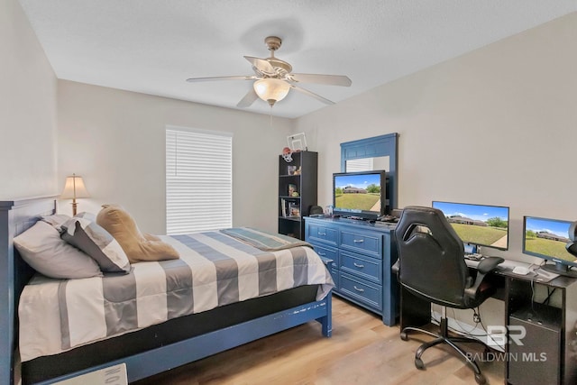 bedroom featuring a ceiling fan and light wood-style flooring