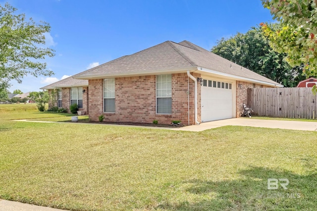 single story home featuring driveway, a front yard, a garage, brick siding, and fence