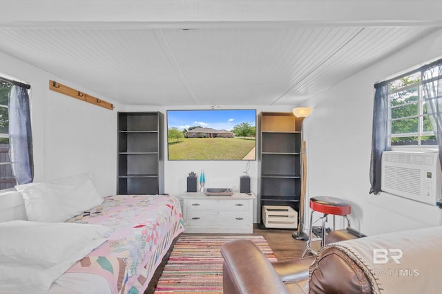 bedroom featuring cooling unit and wood finished floors