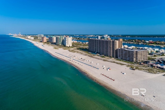 birds eye view of property featuring a view of the beach and a water view