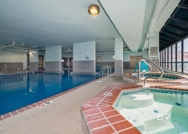 view of pool with an indoor hot tub