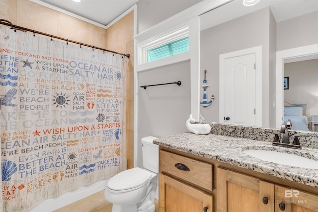 bathroom with toilet, shower / bath combo with shower curtain, and vanity