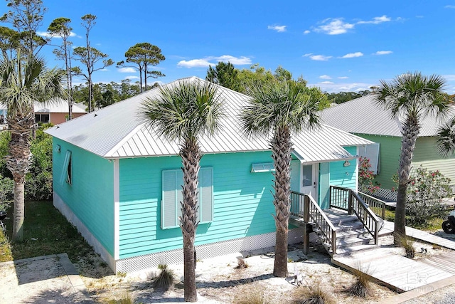 exterior space featuring a standing seam roof and metal roof