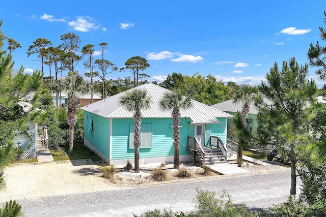 view of front of property featuring metal roof