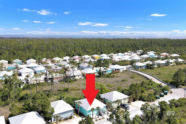 bird's eye view with a residential view and a wooded view