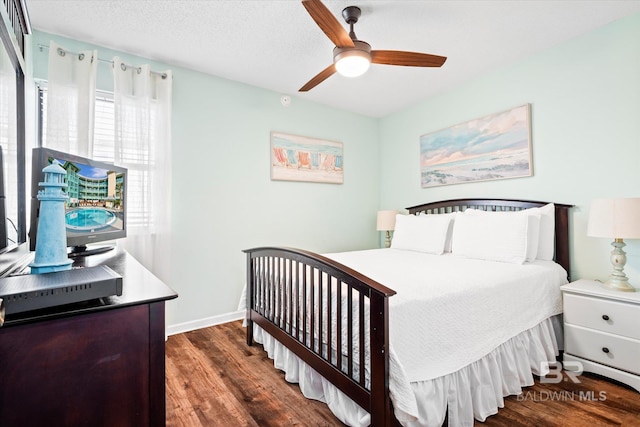 bedroom featuring ceiling fan and dark hardwood / wood-style floors