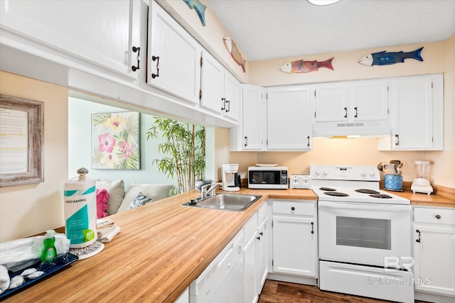 kitchen featuring white cabinets, white appliances, dark hardwood / wood-style floors, and sink