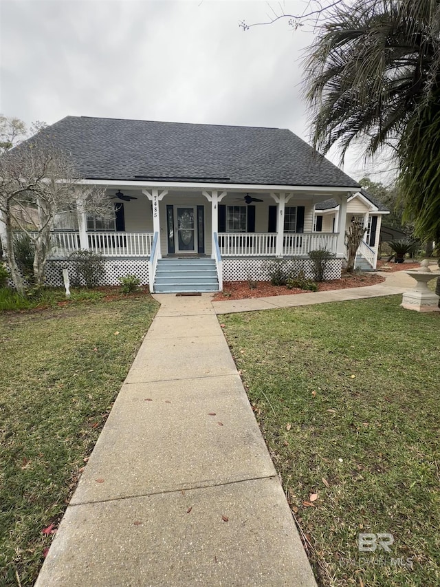 view of front facade with a front yard and a porch