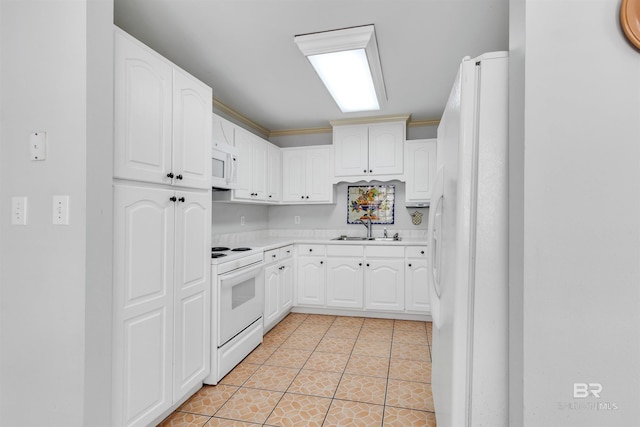 kitchen featuring white cabinetry, sink, white appliances, light tile patterned floors, and ornamental molding