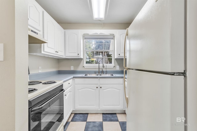 kitchen with white cabinetry, sink, white fridge, and range with electric cooktop