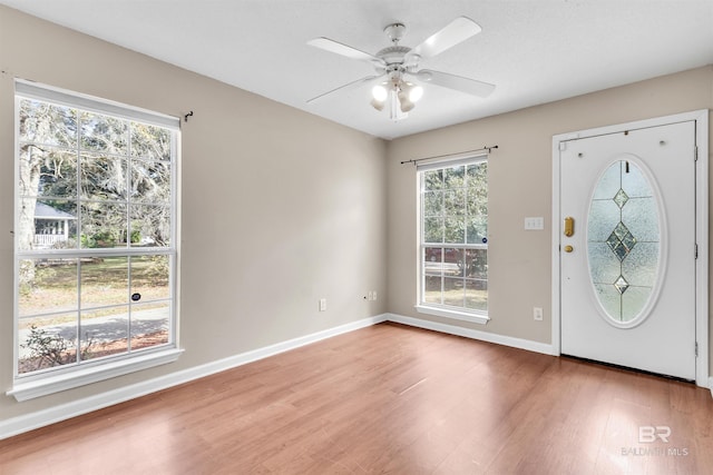 entryway featuring hardwood / wood-style flooring and ceiling fan