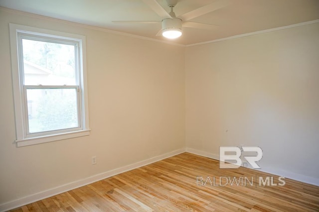 empty room with light wood-type flooring, ceiling fan, and crown molding