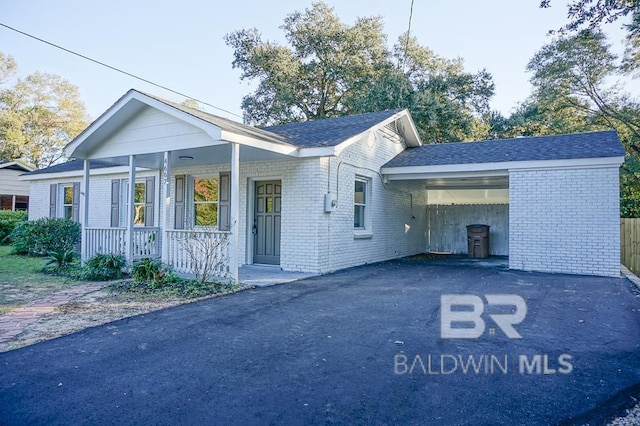 ranch-style home with covered porch