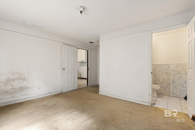 672 Burden St, Mobile, AL 36607 - unfurnished bedroom with carpet and ensuite bathroom