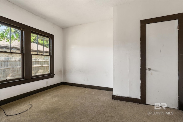 672 Burden St, Mobile, AL 36607 - empty room with carpet flooring and baseboards