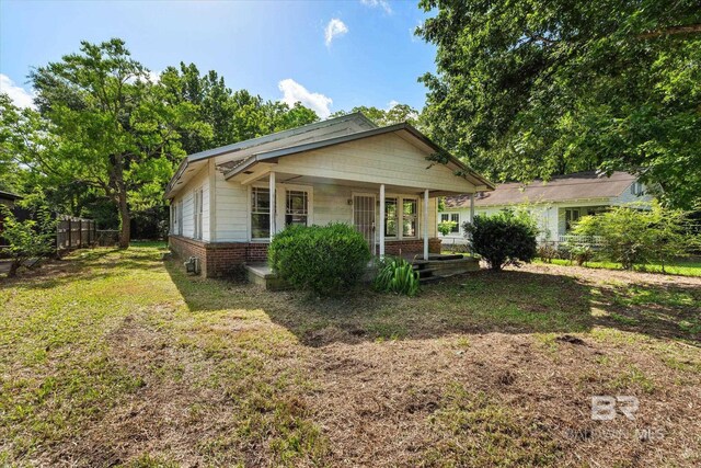 672 Burden St, Mobile, AL 36607 - view of front facade featuring covered porch