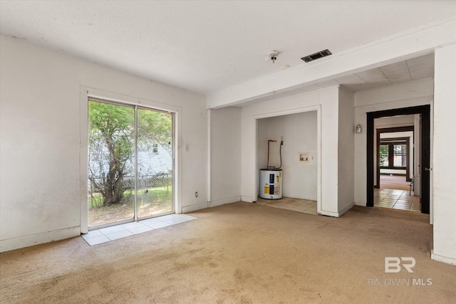 672 Burden St, Mobile, AL 36607 - unfurnished living room with water heater, carpet floors, and healthy amount of natural light
