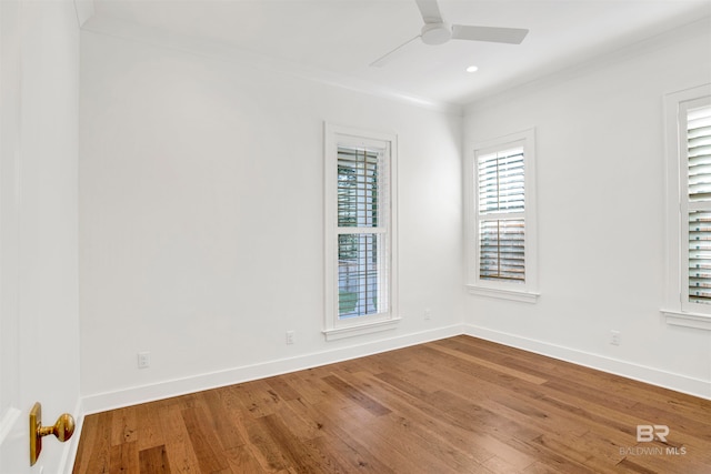 unfurnished room with hardwood / wood-style floors, crown molding, and ceiling fan