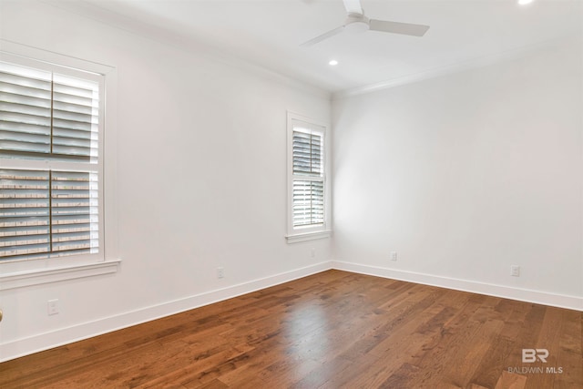 spare room featuring ceiling fan, crown molding, and wood-type flooring