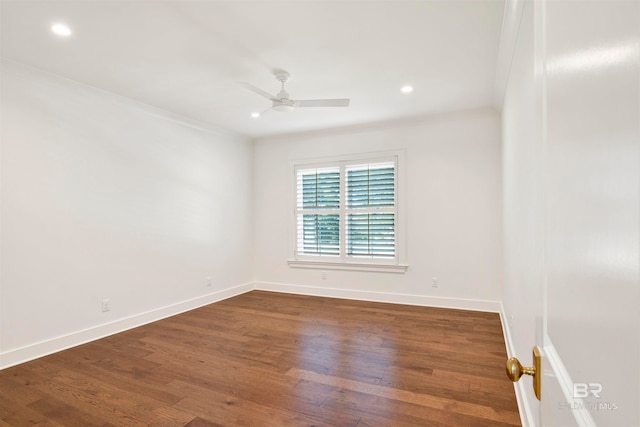 spare room with ceiling fan, crown molding, and dark hardwood / wood-style floors