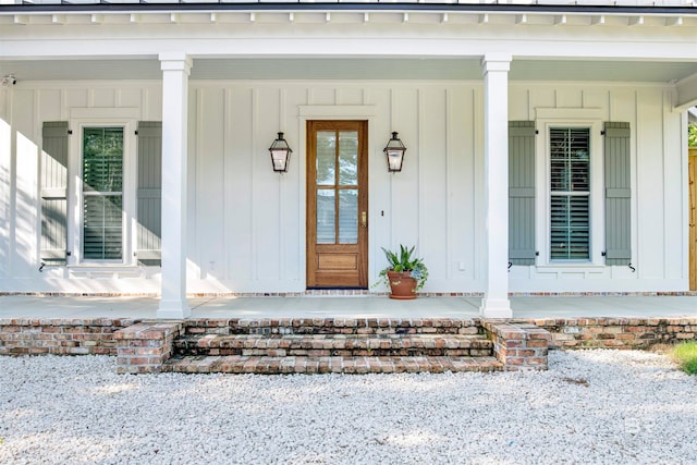 view of exterior entry with covered porch