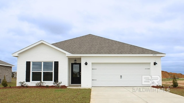 8992 Chabo Cir, Foley, AL 36535 - view of front of home featuring roof with shingles, concrete driveway, an attached garage, and board and batten siding