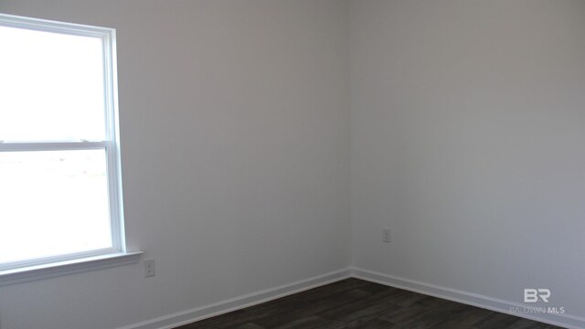 8992 Chabo Cir, Foley, AL 36535 - spare room with dark wood-style floors and baseboards