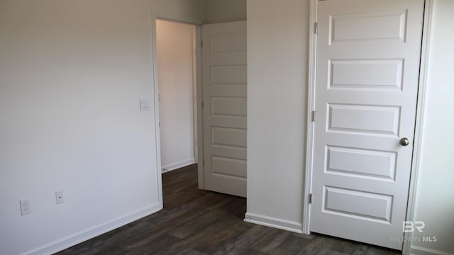 8992 Chabo Cir, Foley, AL 36535 - unfurnished bedroom featuring dark wood-style floors and baseboards