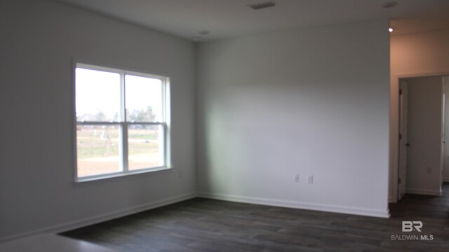 8992 Chabo Cir, Foley, AL 36535 - empty room featuring healthy amount of natural light, dark wood-style flooring, and baseboards