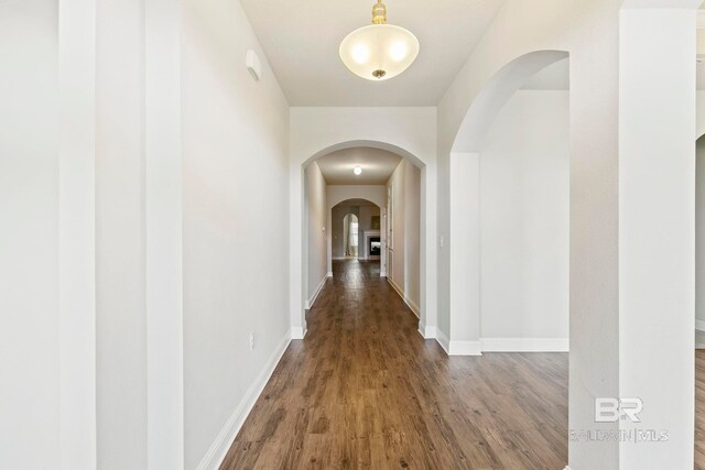 unfurnished living room with wood-type flooring