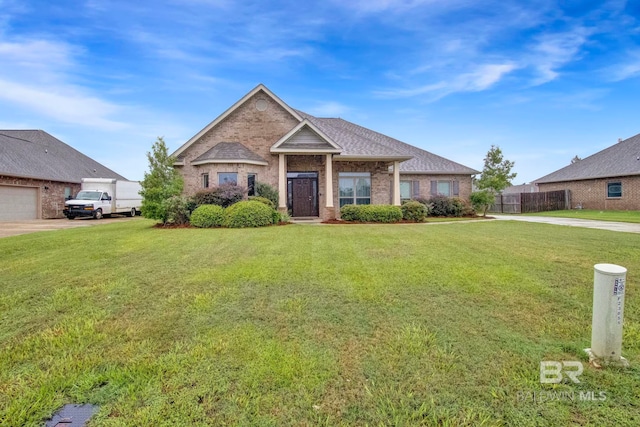 view of front of home featuring a garage and a front lawn