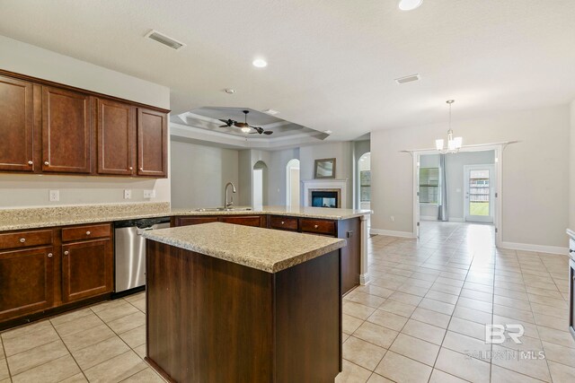 kitchen with light tile patterned floors, an inviting chandelier, decorative light fixtures, and appliances with stainless steel finishes