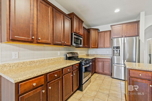 unfurnished living room with a high end fireplace, crown molding, hardwood / wood-style floors, and ceiling fan