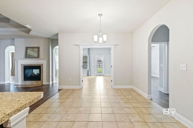 tiled empty room with ceiling fan