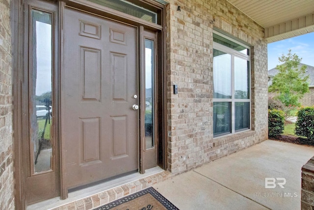 entrance to property with covered porch