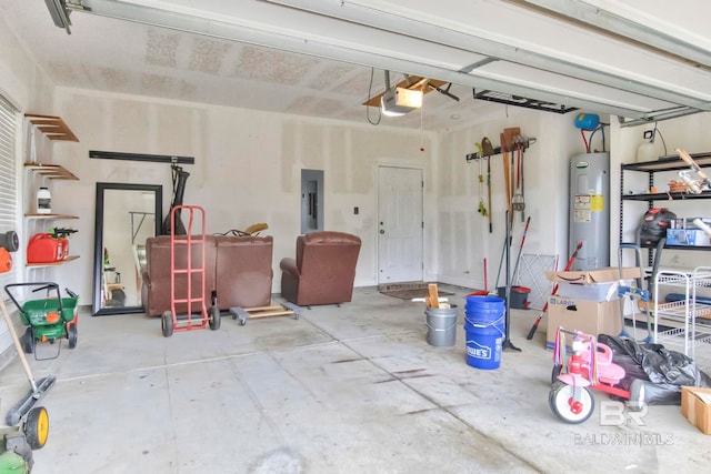 garage with a garage door opener, electric panel, and electric water heater