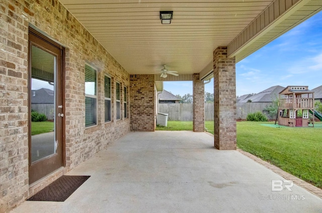 view of patio / terrace with a playground and ceiling fan