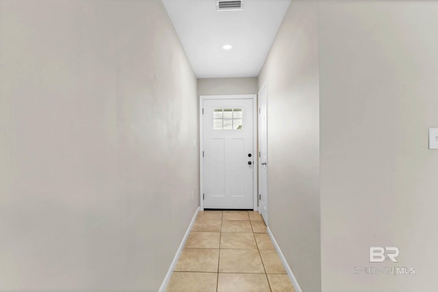 15030 Marem Dr, Foley, AL 36535 - doorway to outside featuring baseboards and light tile patterned floors
