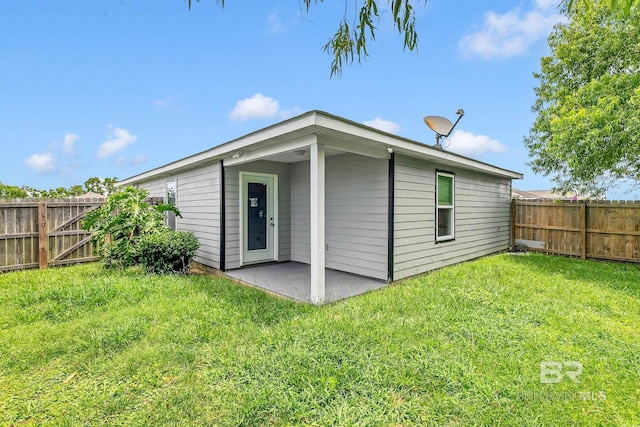 15030 Marem Dr, Foley, AL 36535 - rear view of house with a fenced backyard and a patio area