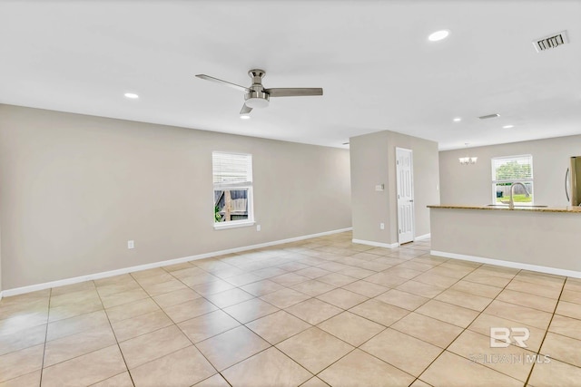 15030 Marem Dr, Foley, AL 36535 - spare room with ceiling fan, a chandelier, recessed lighting, and light tile patterned floors