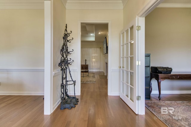 hallway with crown molding and wood-type flooring