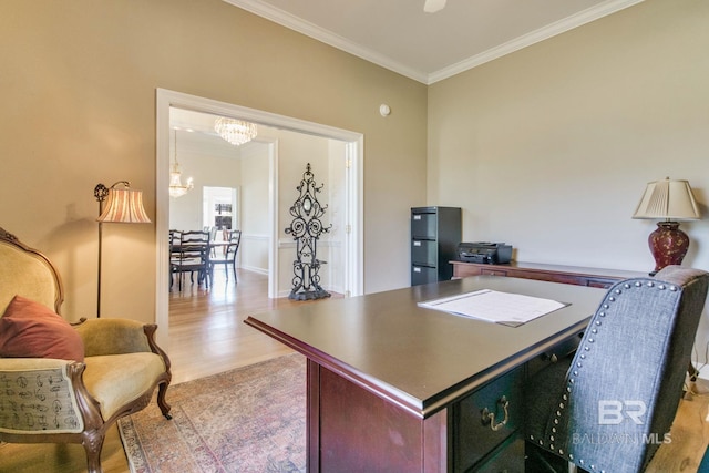 office area with light wood-type flooring, crown molding, and a chandelier