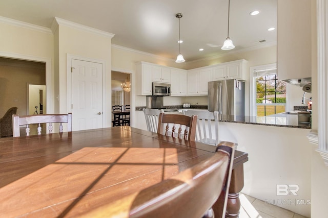 dining room featuring ornamental molding