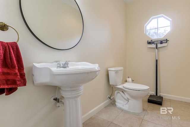 bathroom featuring tile patterned flooring and toilet