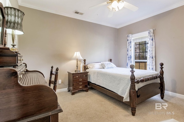 bedroom featuring ceiling fan, ornamental molding, and light carpet
