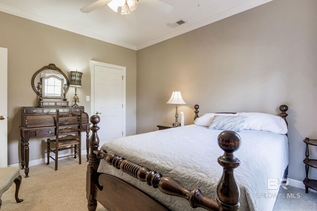 carpeted bedroom featuring ceiling fan and crown molding