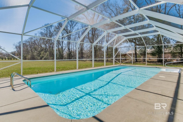 view of swimming pool featuring a patio, glass enclosure, and a lawn