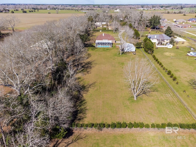 birds eye view of property with a rural view