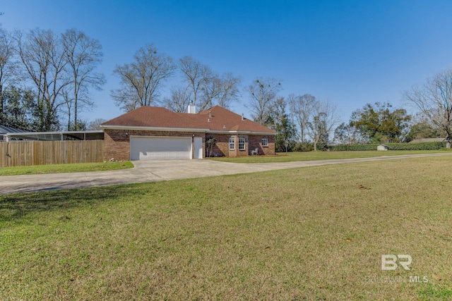 ranch-style house with a garage and a front lawn