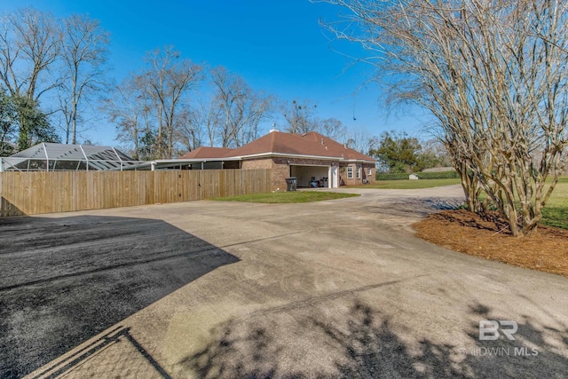 view of side of home featuring a garage
